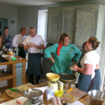valentina with course participants in the kitchen